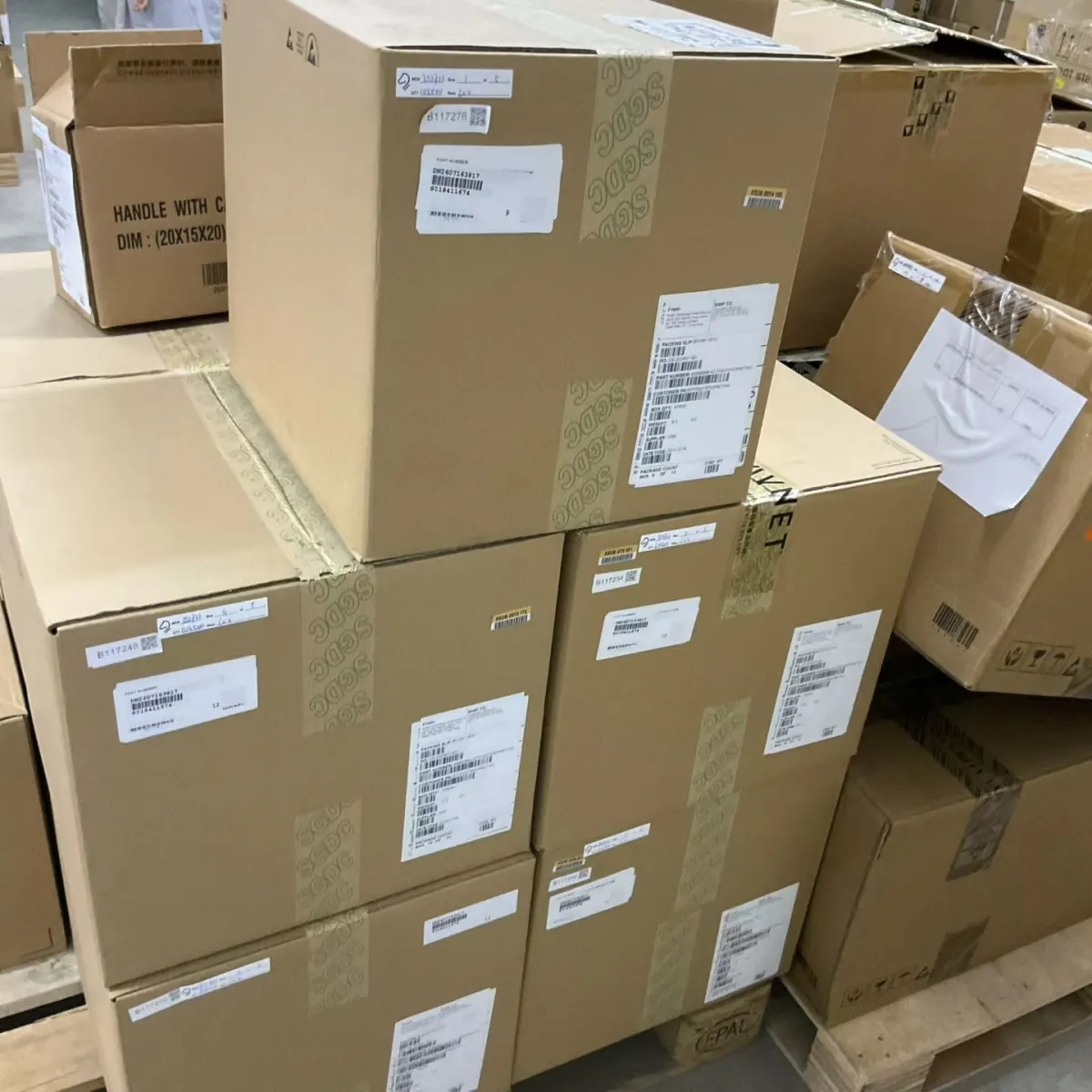 Labelled component cartons stacked for receiving